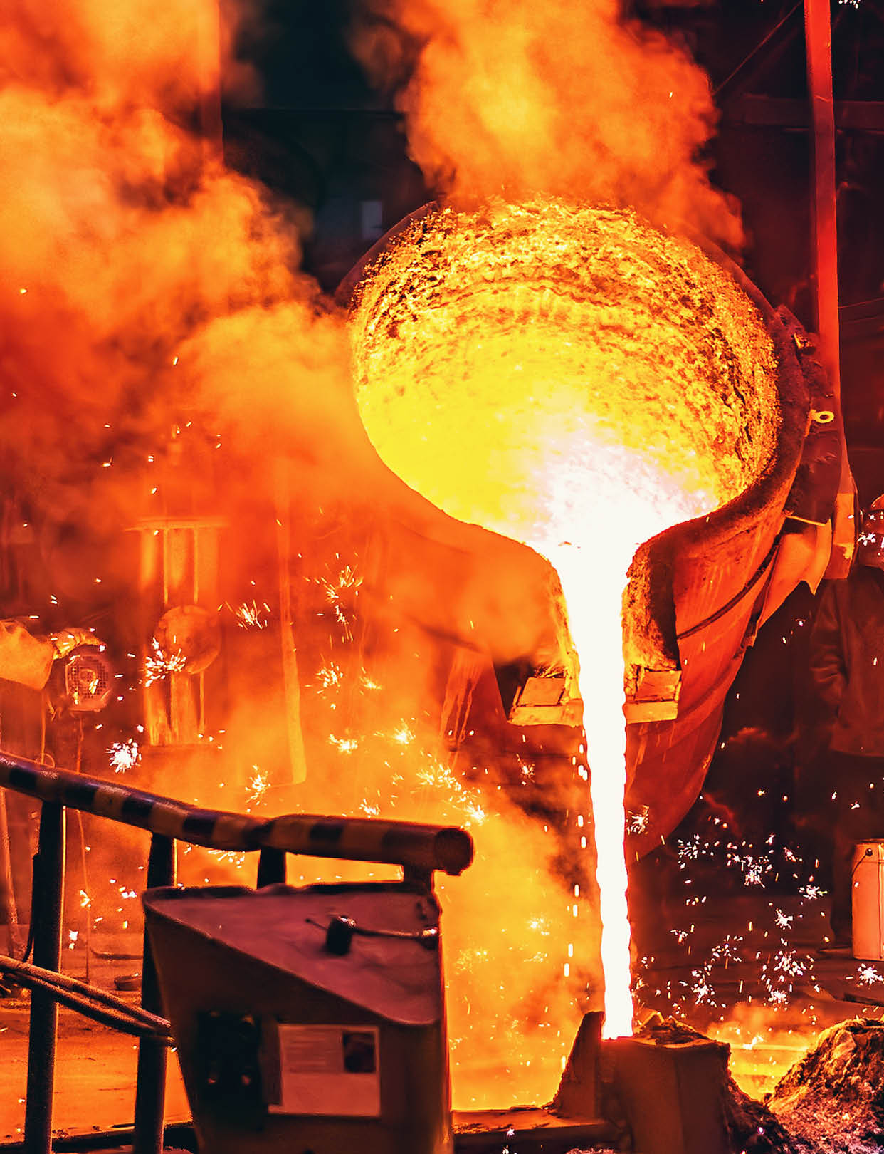 Liquid iron molten metal pouring in container, industrial metallurgical factory, foundry cast, heavy industry background.
